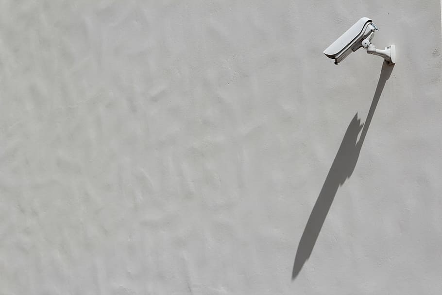 bullet security camera mounted on white painted wall, facade HD wallpaper