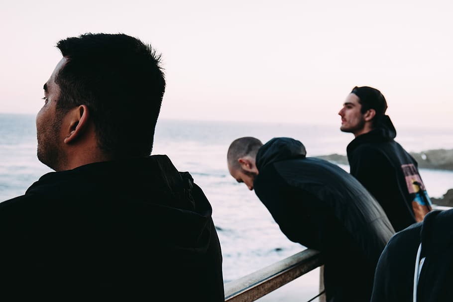 three men near rail near sea, three men standing in front railing HD wallpaper