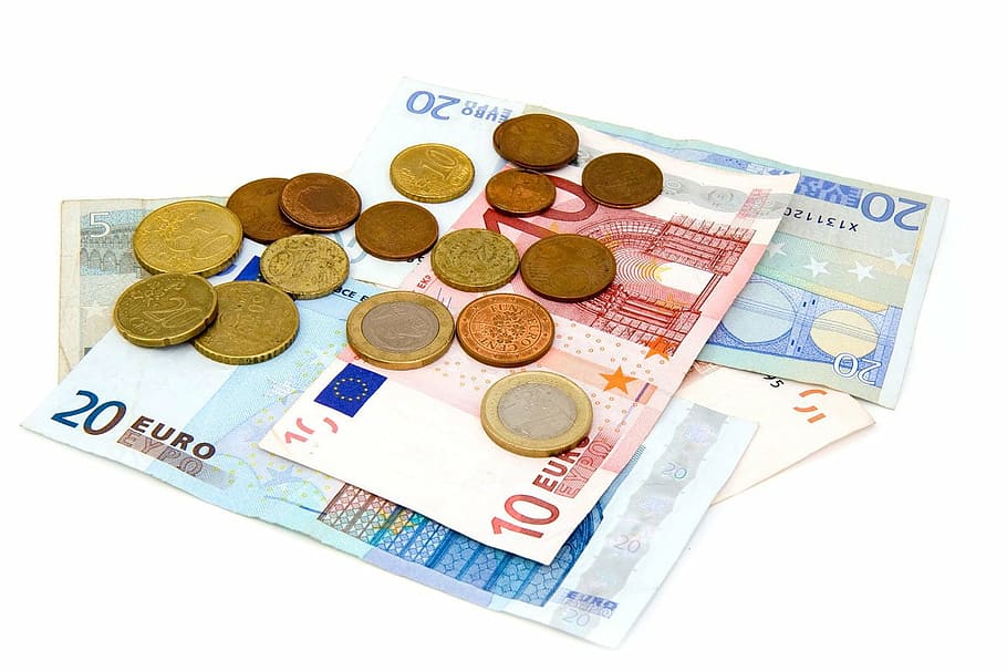 gold-colored and copper-colored coins on assorted banknotes HD wallpaper