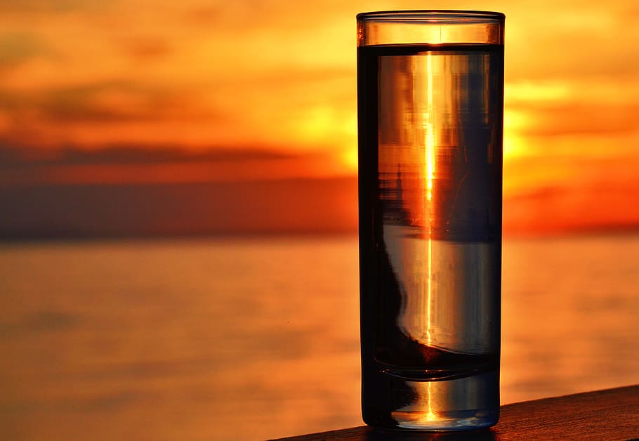 Clear Highball Glass on Brown Surface during Golden Hour, clouds HD wallpaper