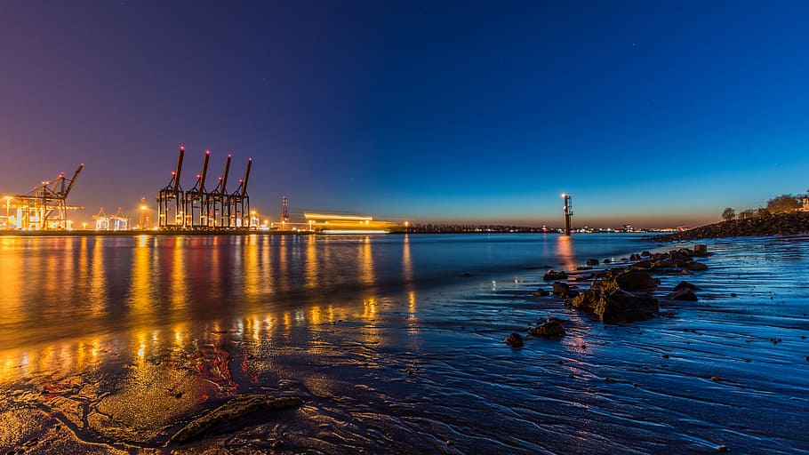 body of water near tower cranes, waters, sunset, dawn, dusk HD wallpaper