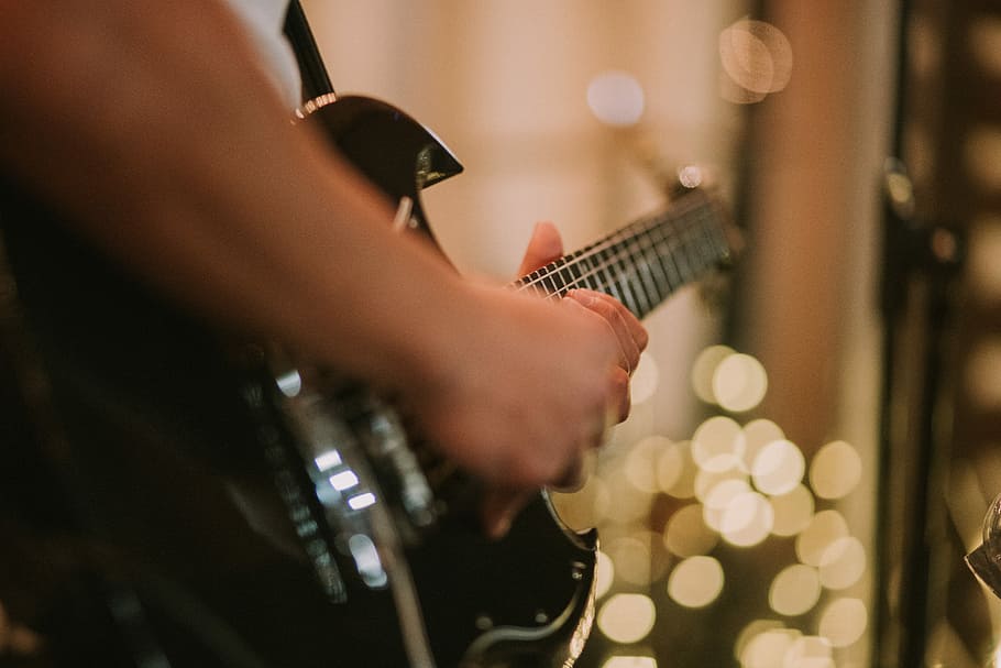 person playing black SG guitar, bokeh photography of person playing guitar HD wallpaper