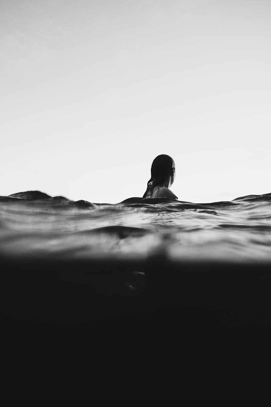 woman on body of water, selective focus photo of woman swimming