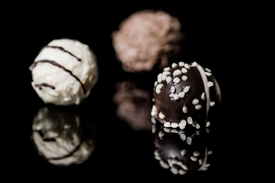 selective focus photography of two ball donuts, praline, chocolates, HD wallpaper