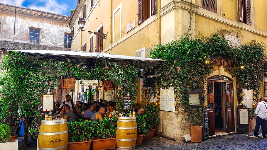 two brown wooden wine barrels placed near restaurant, rome, italy