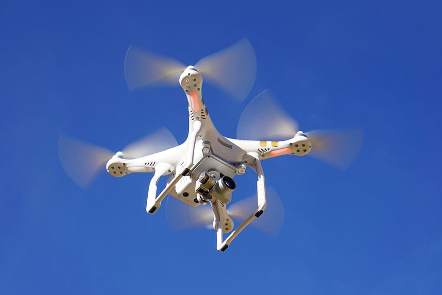 low angle photo of flying DJI Phantom 3 Professional, drone, camera