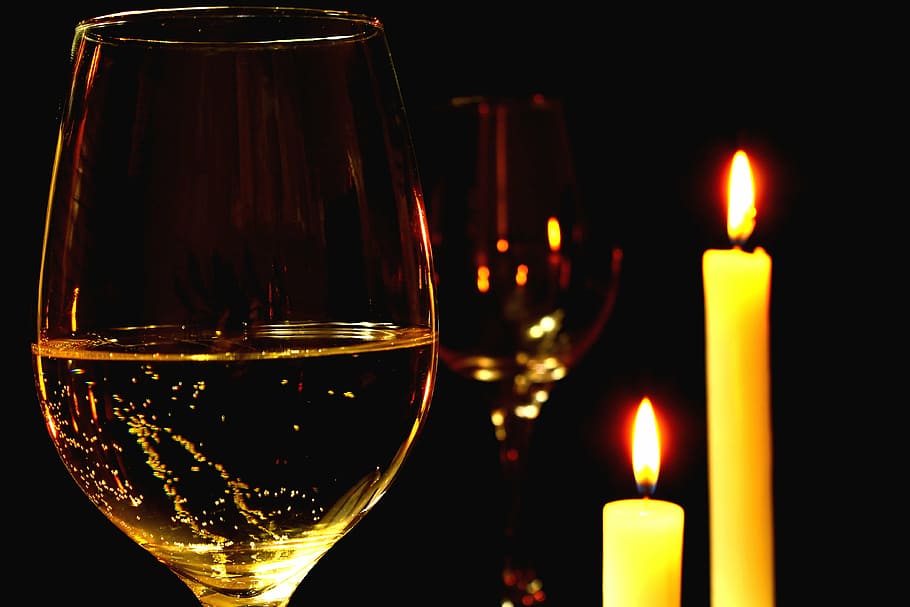 two wine glasses beside two taper candles, romantic, romantic dinner HD wallpaper