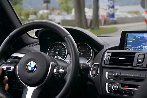 person holding black BMW steering wheel, car, driving, route HD wallpaper
