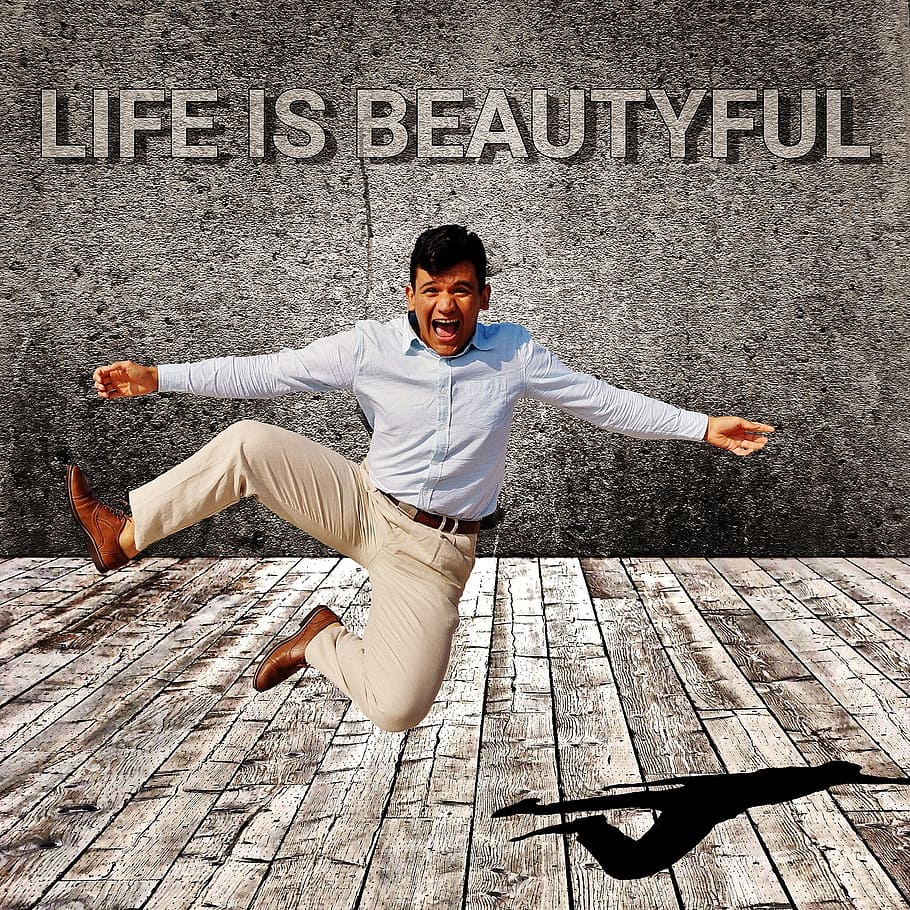 man in white dress shirt and brown dress pants jumping with Life is beautiful text overlay, HD wallpaper