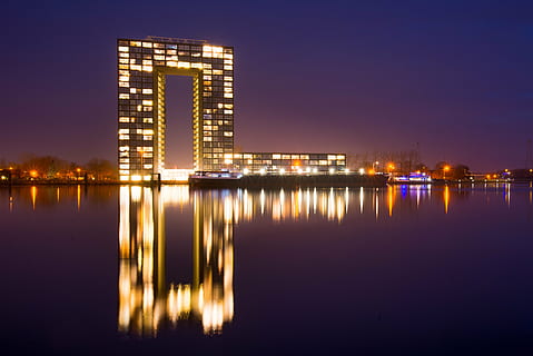 lighted building near body of water at nighttime, groningen HD wallpaper
