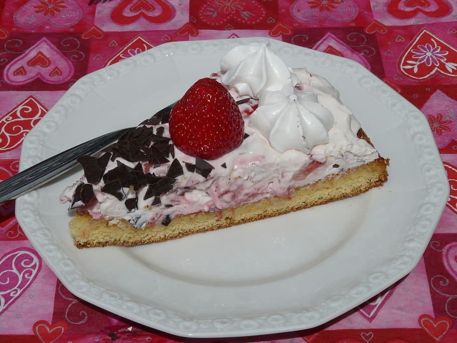 strawberry and white icing cake on white ceramic plate, piece of cake