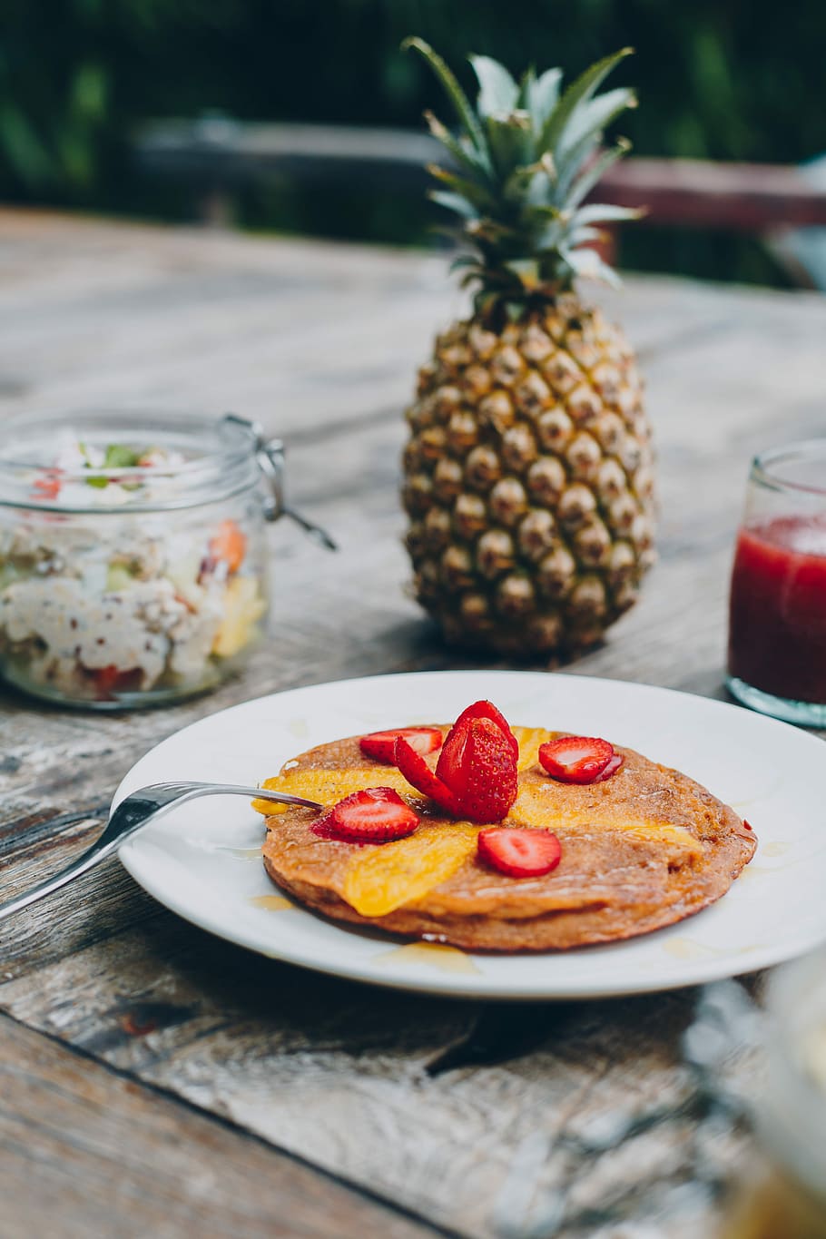 sliced strawberries, strawberry pancake on plate beside pineapple fruit HD wallpaper