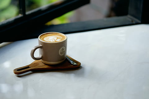 cup of coffee placed on beige wooden paddle with chrome spoon, gray ceramic teacup filled white coffee latte HD wallpaper