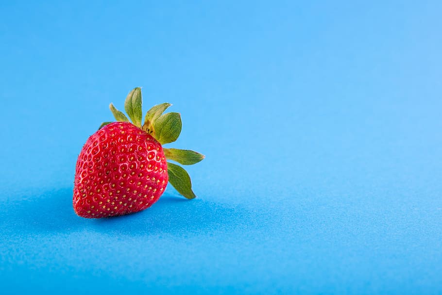 red strawberry on blue surface, power, food, background, fresh HD wallpaper