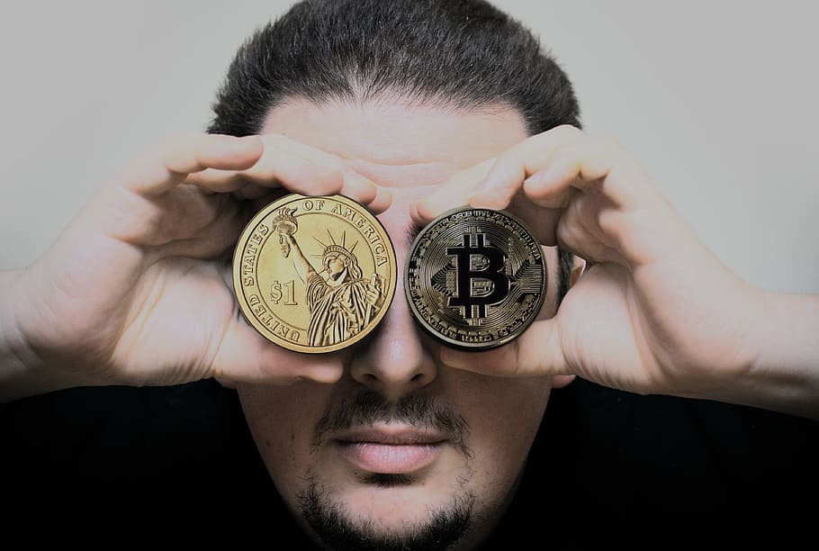 person holding two Bitcoin and USA coins, hand, man, dollar, crypto-currency