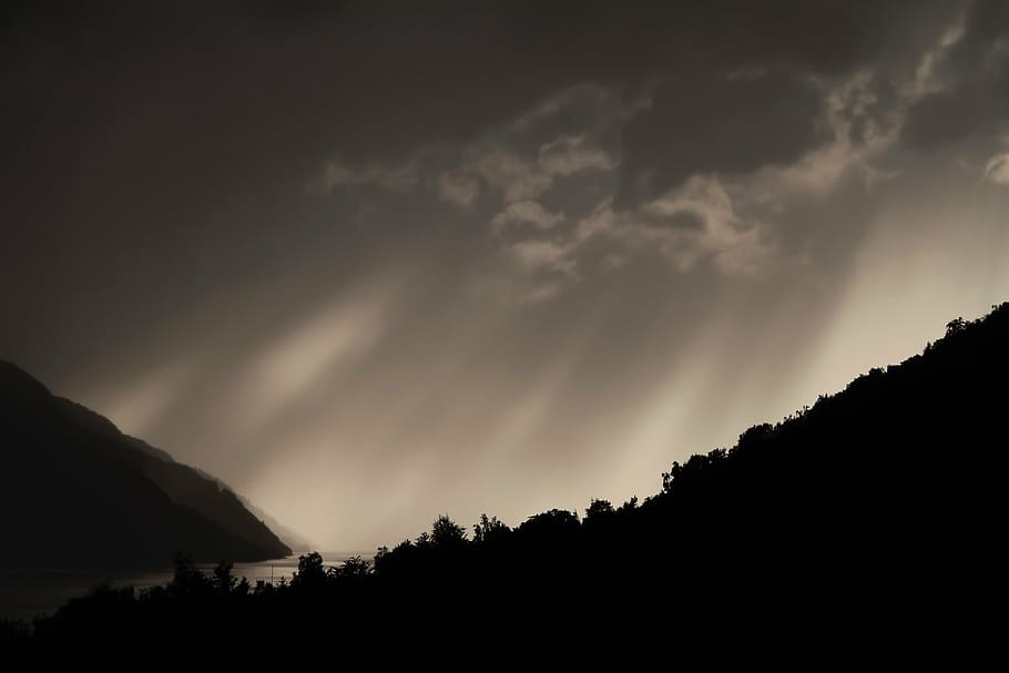 silhouette of trees unde gray sky, mountain, clouds, dark, dramatic sky HD wallpaper