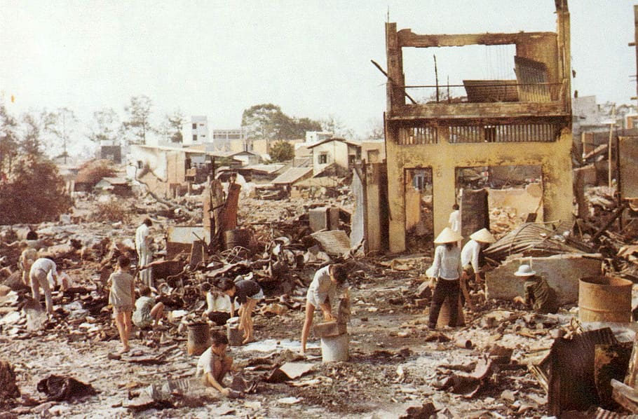 Civilians sort through the ruins of their homes in Cholon in the Vietnam War