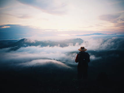 person wearing hat under clouds during daytime, mountain, alone HD wallpaper