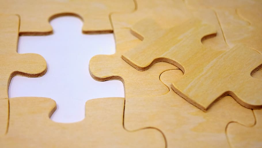 flat lay photograpjhy of jig saw puzzle, last part, joining together