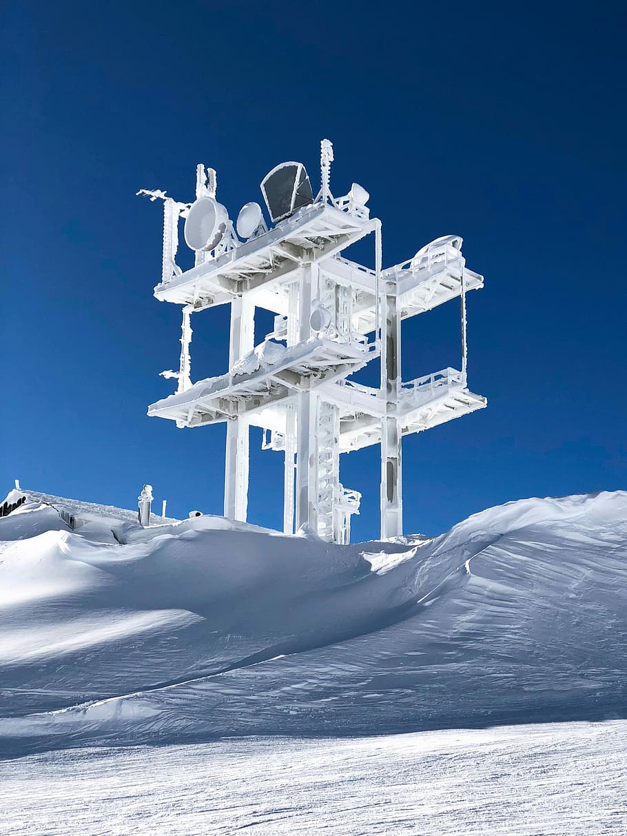 white satellite on snow covered hills, snow-covered field and tower during daytime HD wallpaper