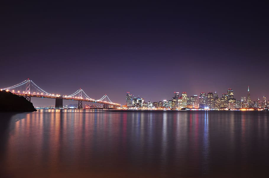 landscape photography of Golden gate, lighted suspension bridge and city buildings, HD wallpaper