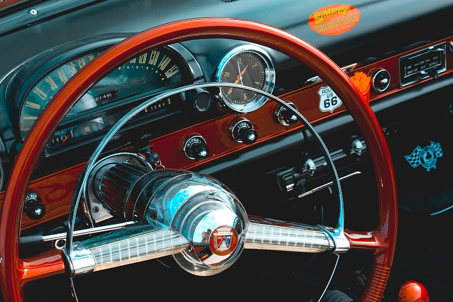 red steering wheel, brown and gray steering wheel, dashboard