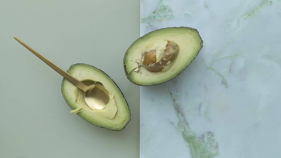 two sliced of avocados, close-up photo of sliced avocado, spoon HD wallpaper