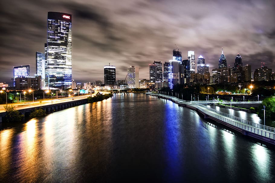 aerial view of city buildings and lake during nighttime, river and city skylines HD wallpaper