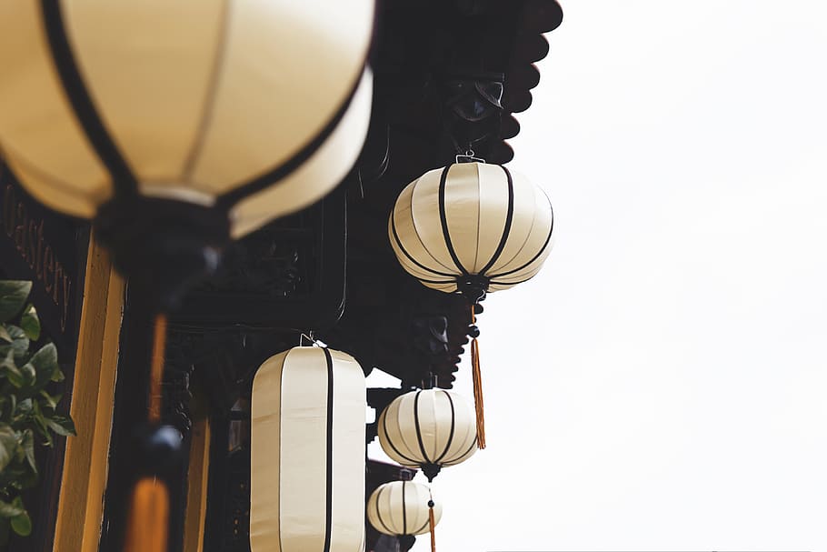 beige lantern hanging near house, selective photography of beige hanging lantern HD wallpaper