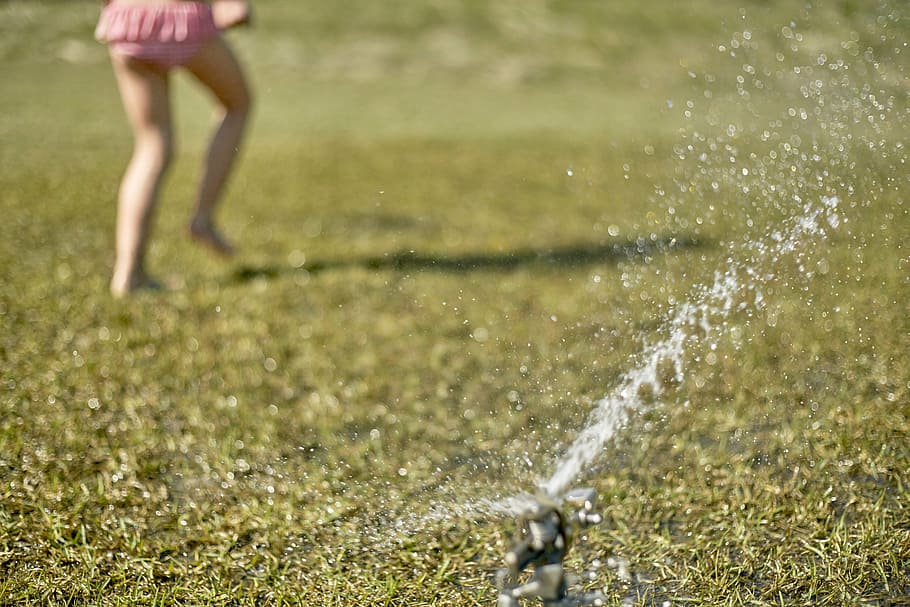 girl playing on grass field with sparkling water, gray, sprinkler HD wallpaper