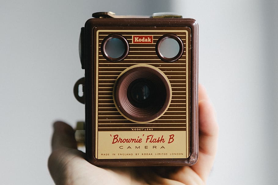person holding brown Kodak brownie flash b camera, box, human hand HD wallpaper