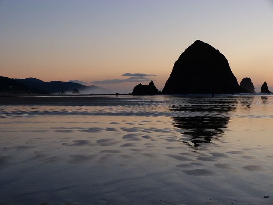 silhouette of rock near sea at golden hour, Cannon Beach, Haystack Rock HD wallpaper