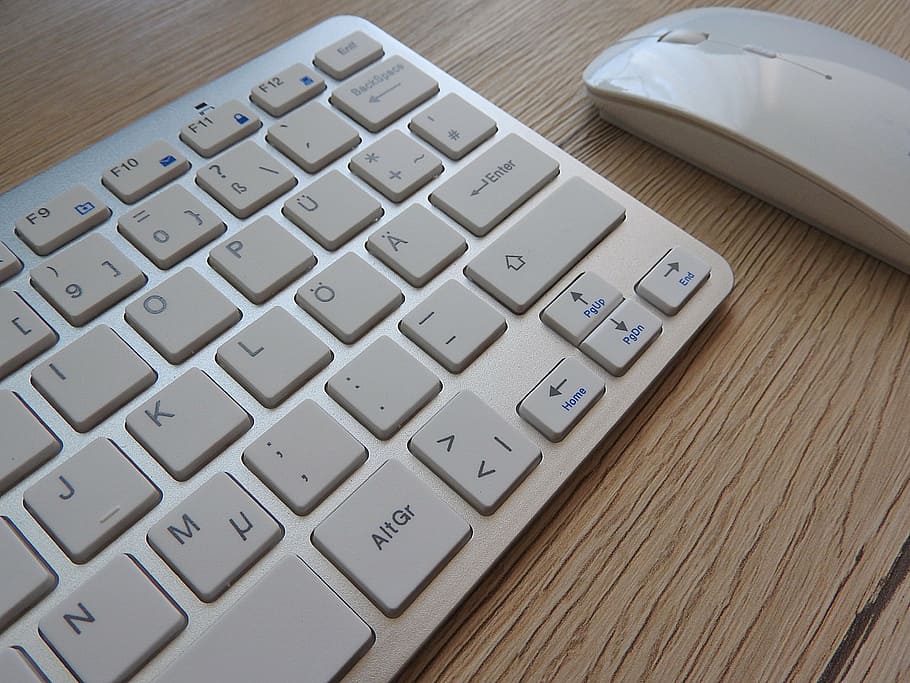 Apple Magic keyboard and mouse on top of table, desk, workplace HD wallpaper
