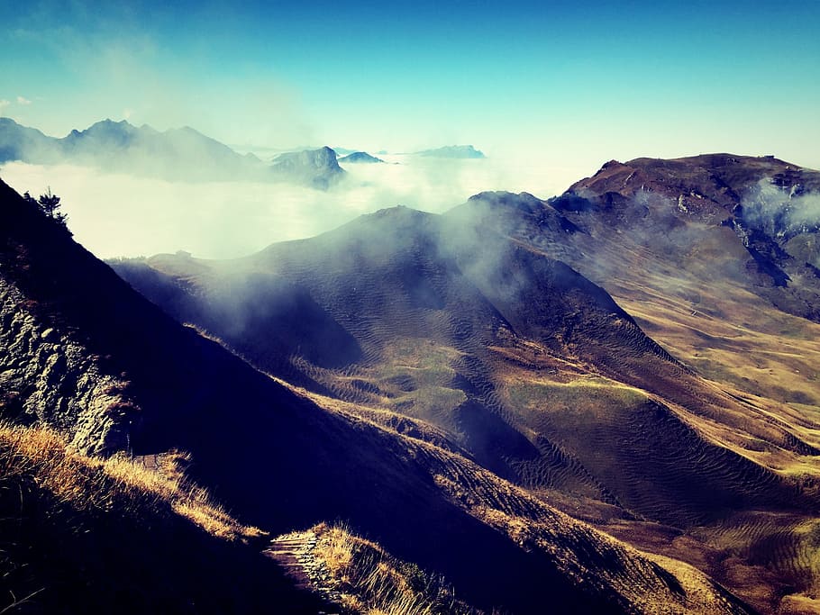 brown mountain under blue sky, mountains, crags, mist, mountain range HD wallpaper