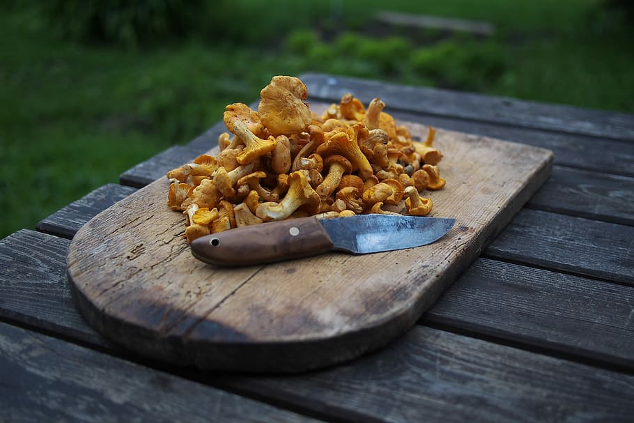 brown wooden chopping board with brown mushrooms on top beside knife, mushroom on brown wooden chopping board HD wallpaper