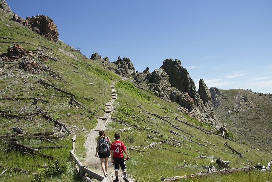two person walking on mountain, hikers, mountain climbing, trail