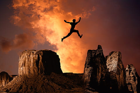 Hd Wallpaper Man Jump From Tip Of Mountain To Another Mountain Cliff High Wallpaper Flare