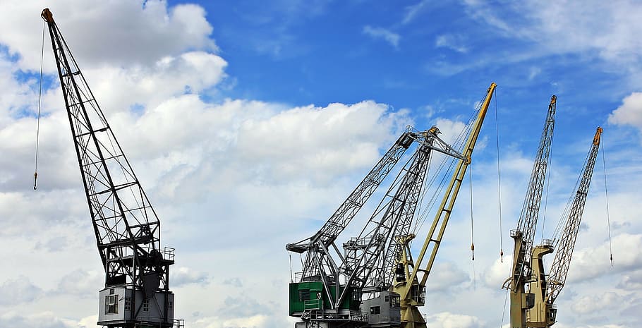 three tower cranes standing beside each other, harbour cranes HD wallpaper