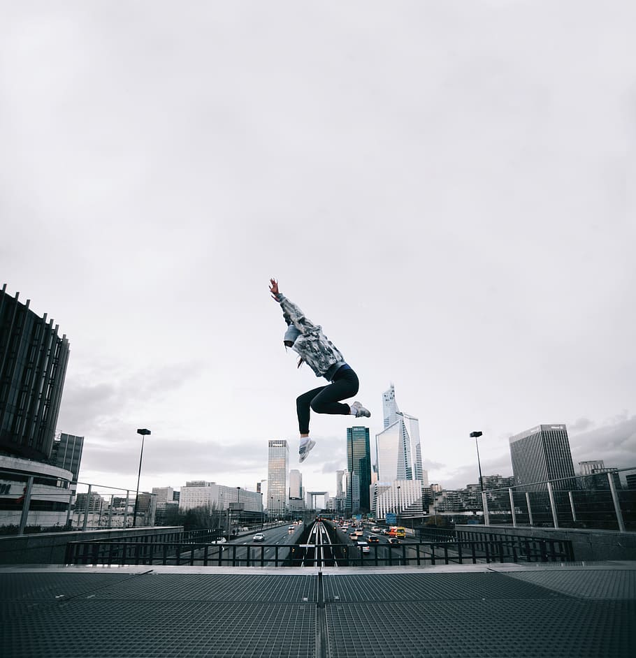 building, vehicle, structure, sky, people, infrastructure, jumping HD wallpaper