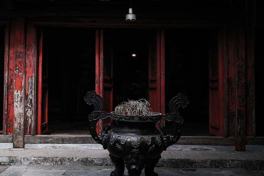brown metal temple, black metal container outside the building HD wallpaper
