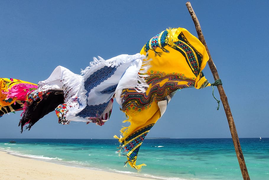 assorted-color clothes hanging on wire, zanzibar, sea, blue, beach