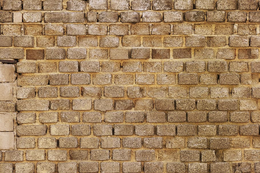 brown concrete brick wall, sand-lime brick, old brick wall, weathered