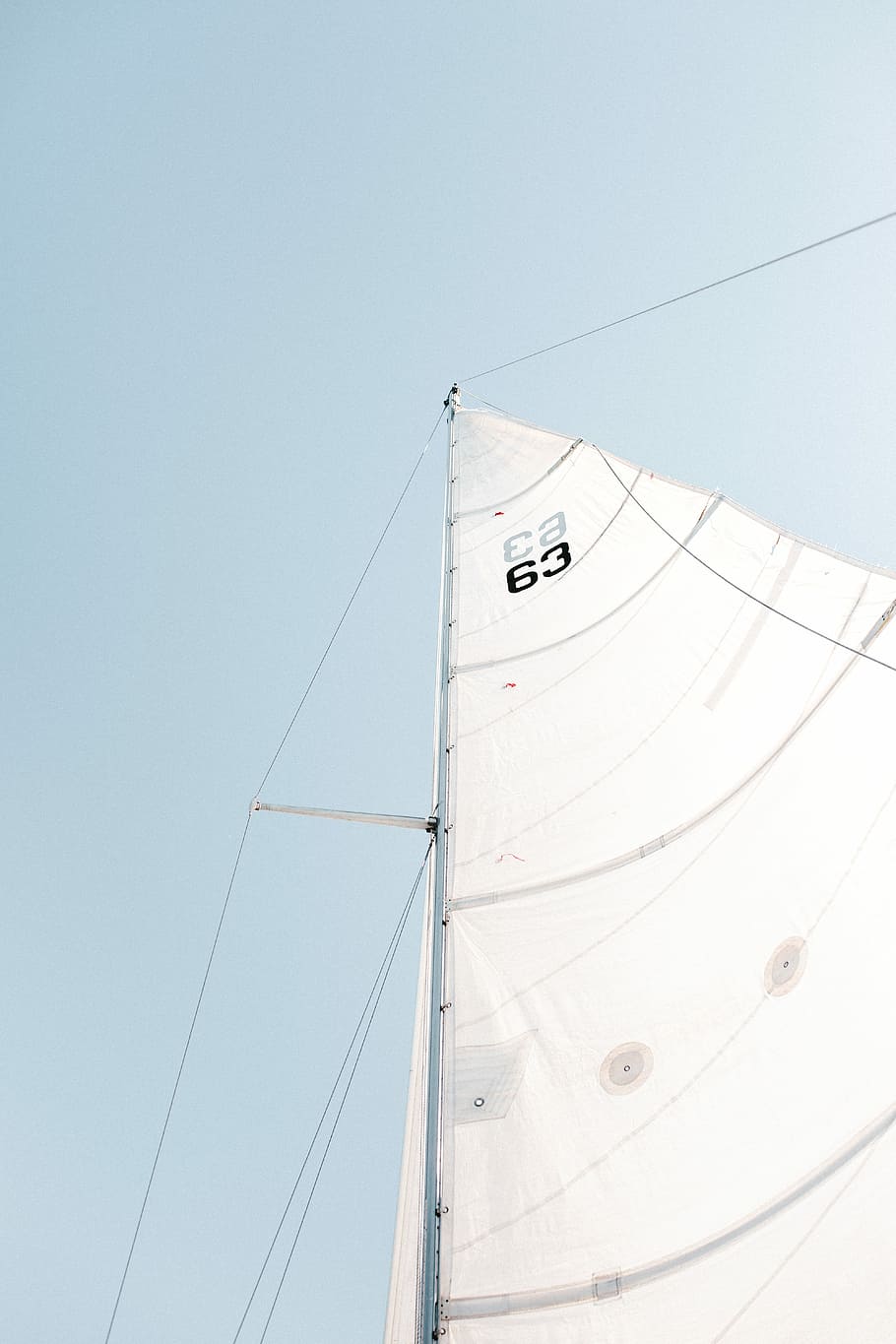 white boat sail, low angle photography of boat sail, sky, mast