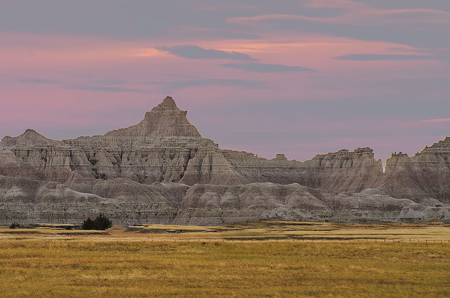 landscape photo of gray mountains, rock formations, badlands