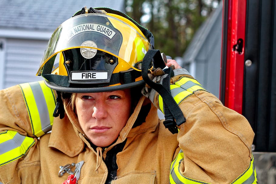 woman wearing bunker gear suit and helmet, woman fire fighter