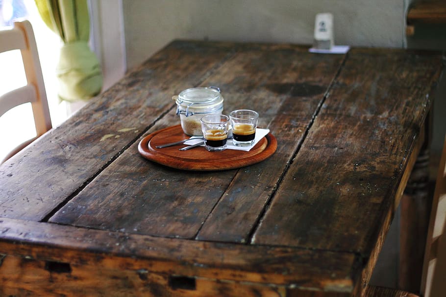 two shot glasses beside mason jar on round brown wooden tray HD wallpaper