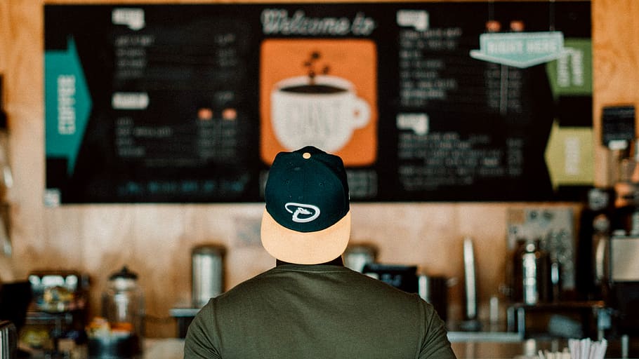 photo of person wearing cap staring at menu board, back view of man facing menu board, HD wallpaper