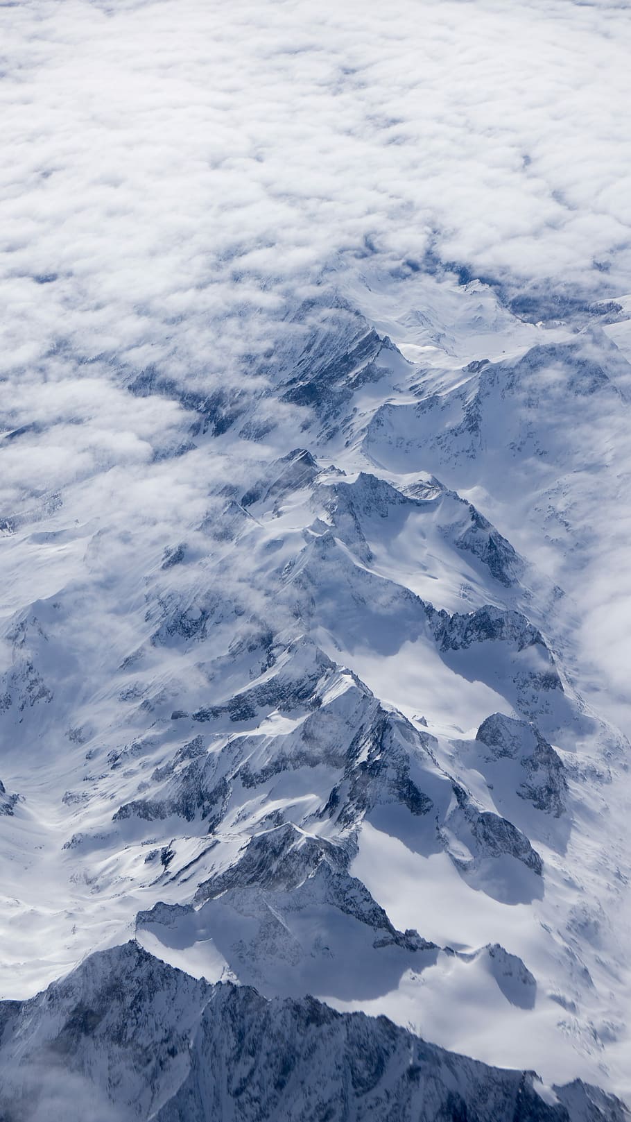 aerial photography of snow mountain, aerial photography of glacier mountain covered by clouds HD wallpaper