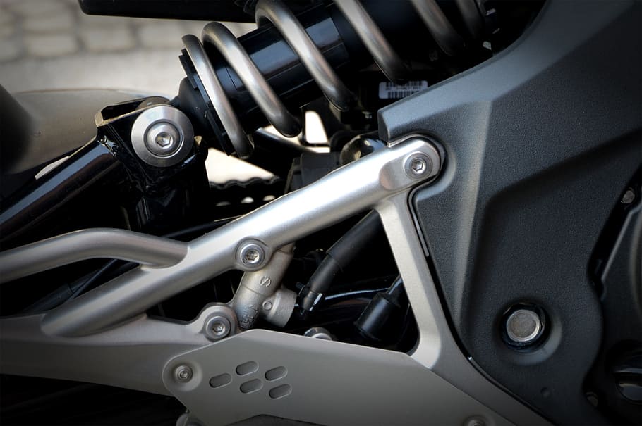 closeup photo of motorcycle coilover, triumph, technology, design HD wallpaper