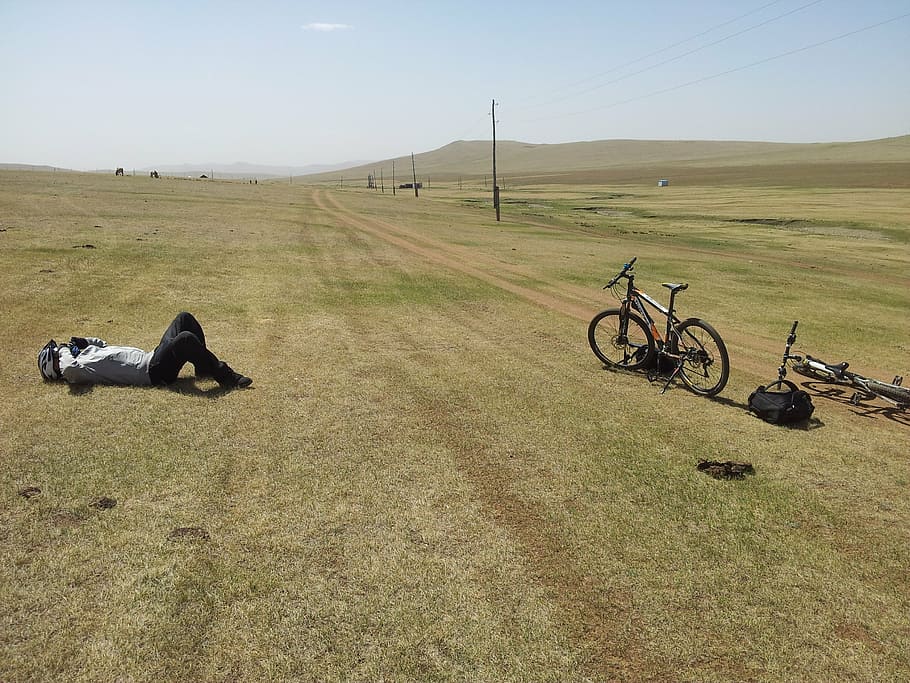 tired, bicyclist, mongolia, bicycle, outdoors, sky, grass, environment